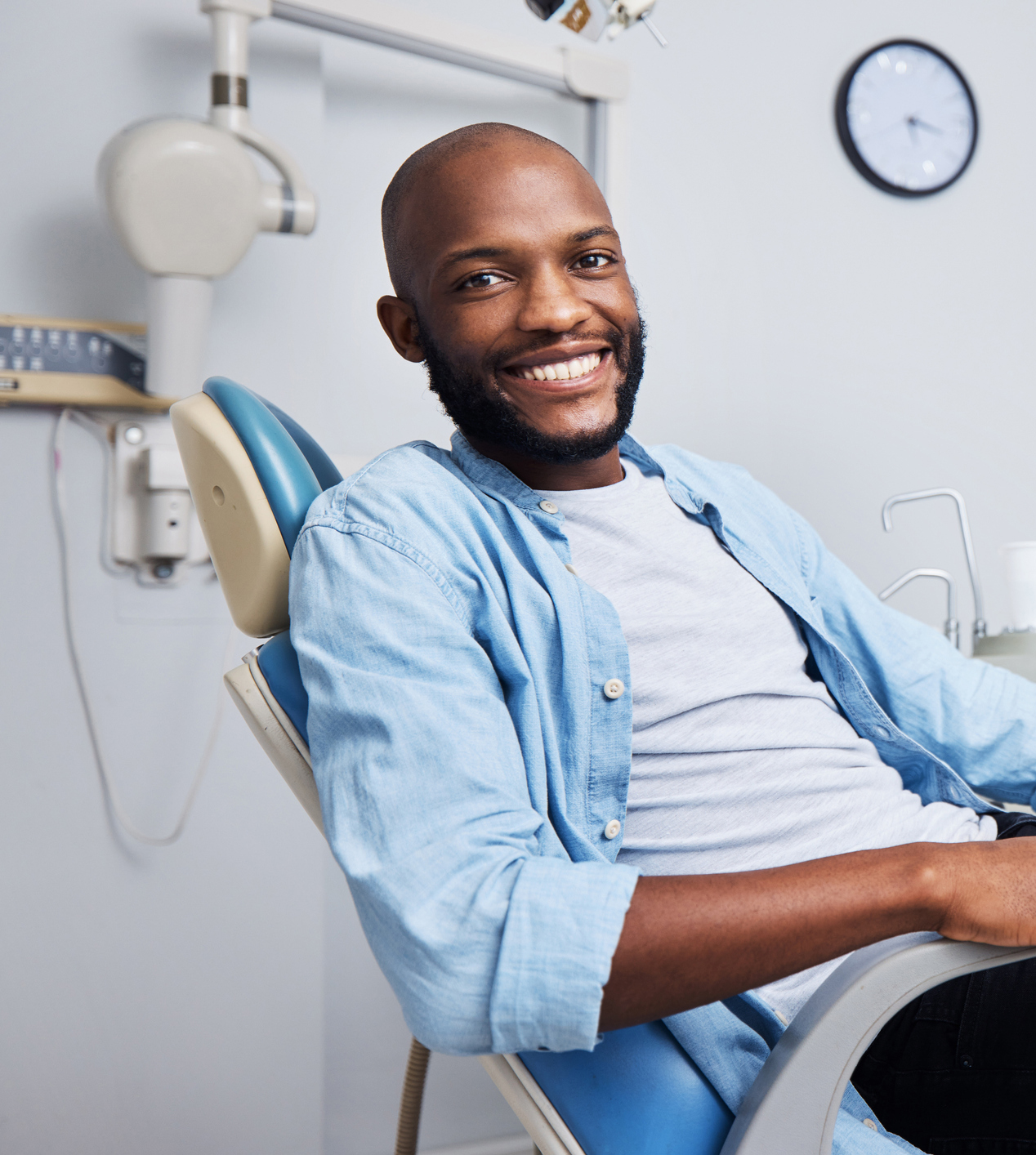 Portrait of a young man having dental work done on his teeth